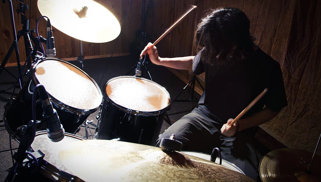 Guides, Tools, and Resources for Audiophiles and Musicians 13 drummer in room